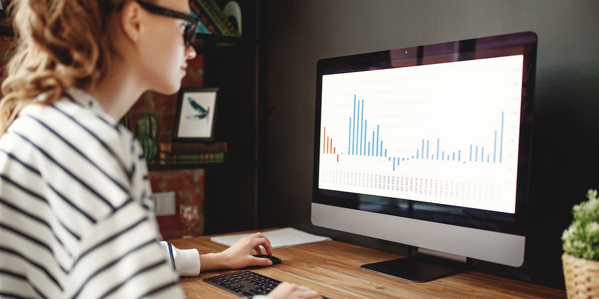 An intern working on data visualizations on a computer as part of their data analyst internship