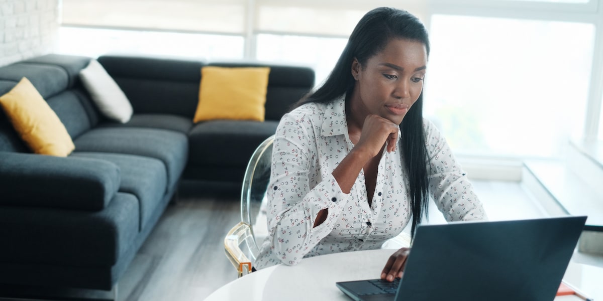 Data analyst works from home on a laptop