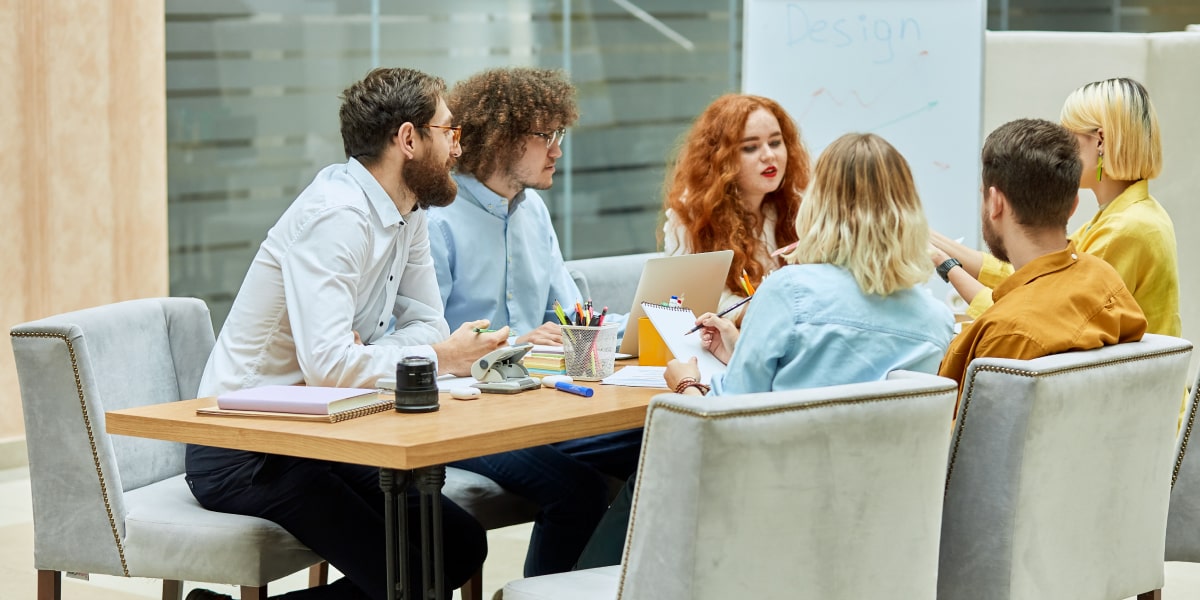 A group of animation designers sitting round a desk