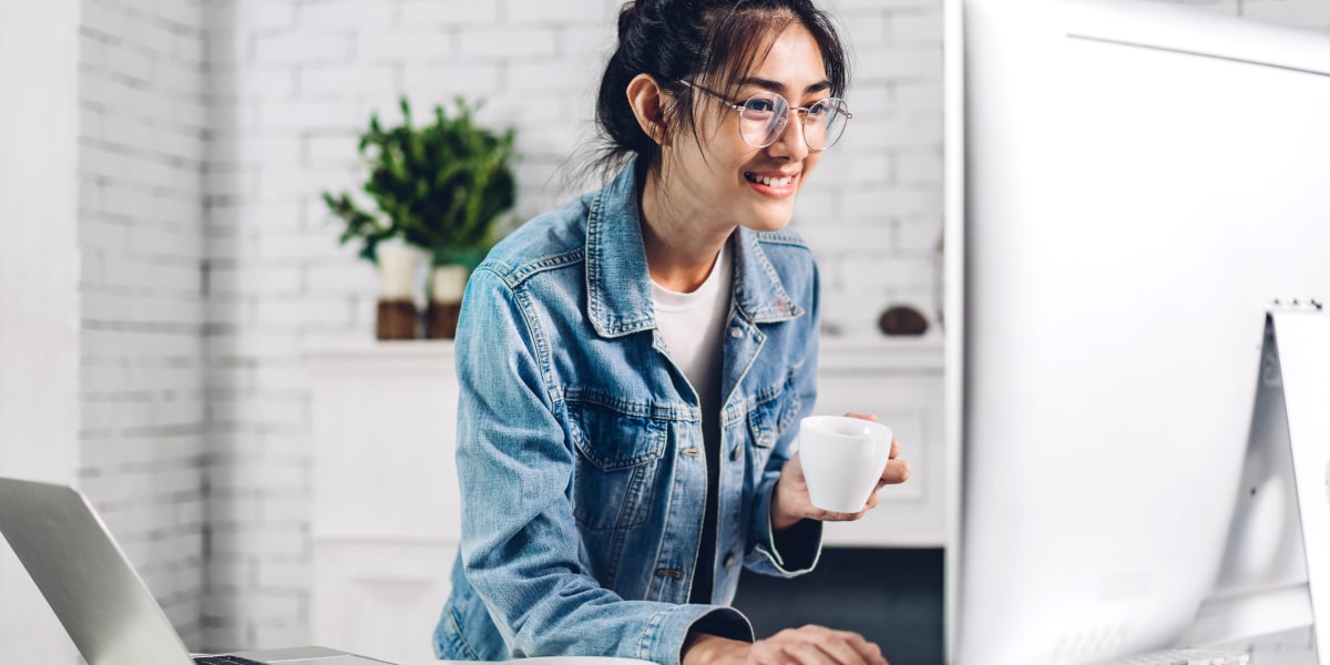 Do you need a degree to become a UI designer? An aspiring designer standing in front of a computer