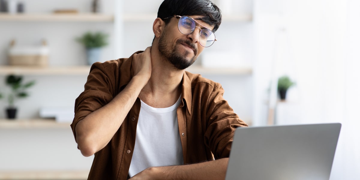 A digital marketing bootcamp student working at a laptop