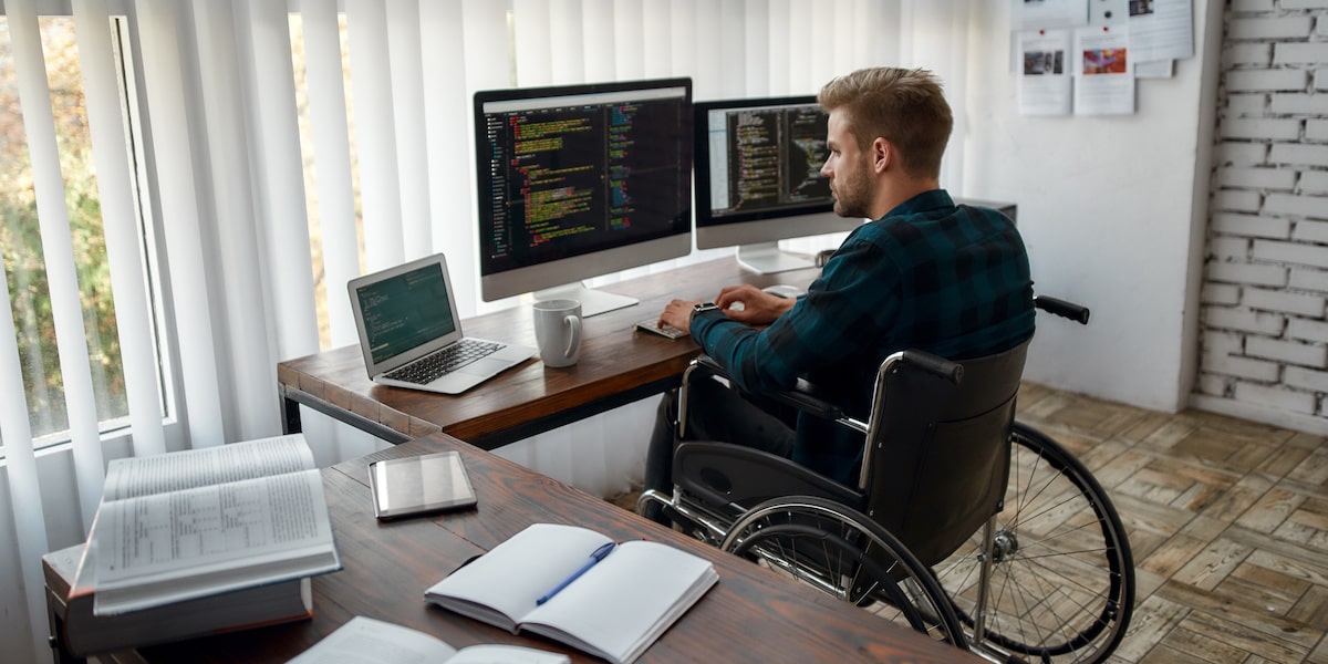 What is SQL? A data analyst writes code on his computer.