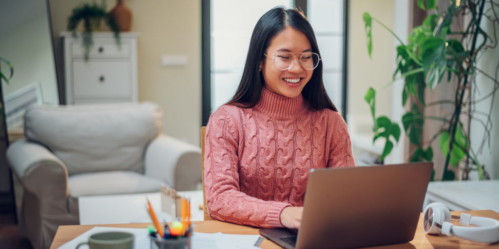 young tech worker researches work from home jobs