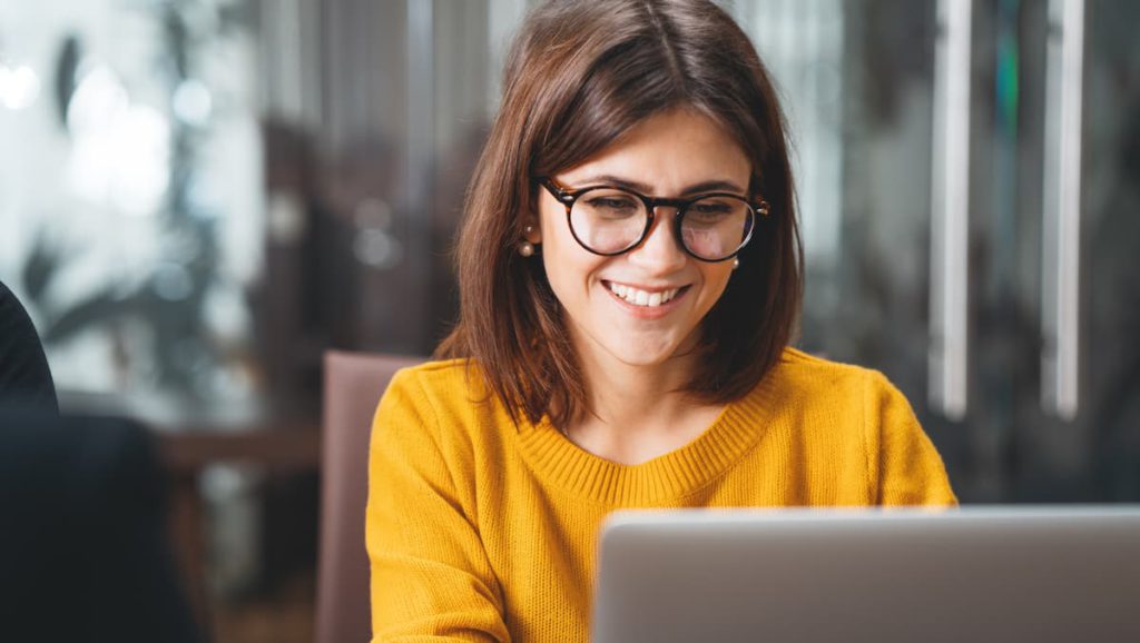 A UX designer does freelance work in a shared working space