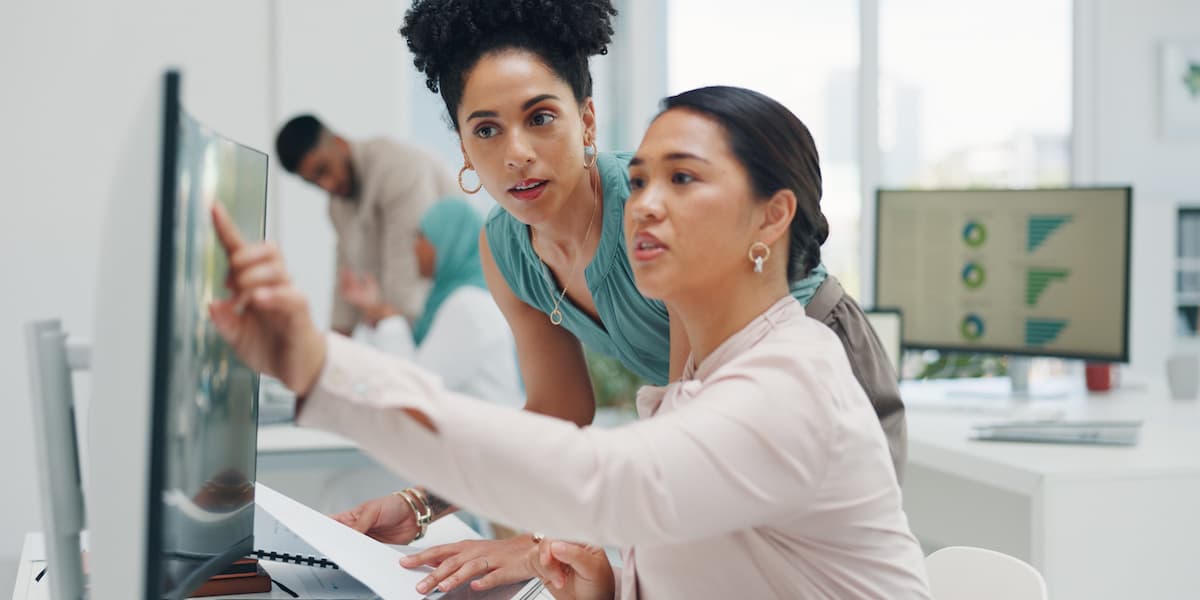 a market research manager highlights easy career changes that pays well on a computer to a digital marketer