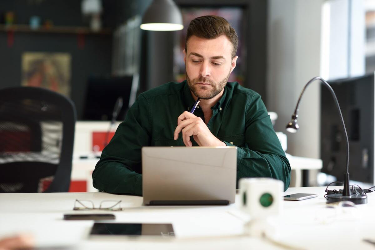 A product designer working at a laptop