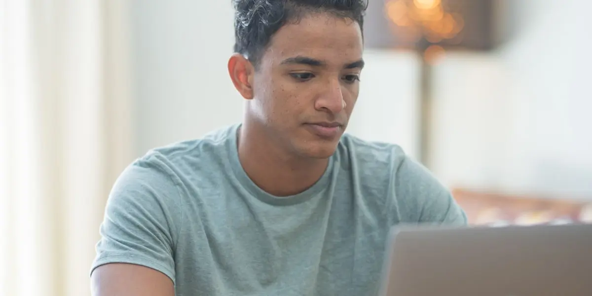 A digital marketing analyst working on a laptop
