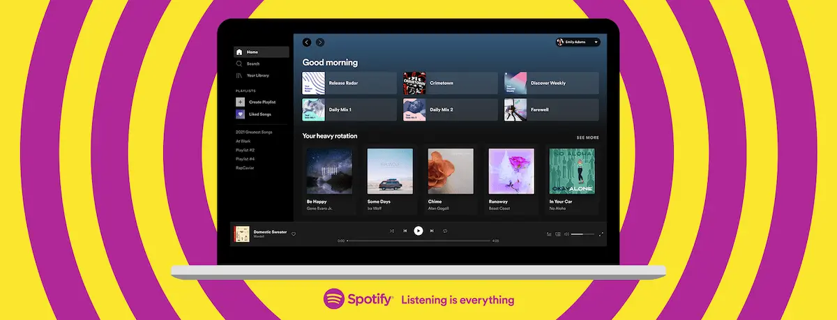 An image of a laptop with the Spotify desktop app open on it.