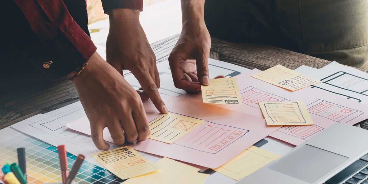 A collection of paper prototypes on a desk