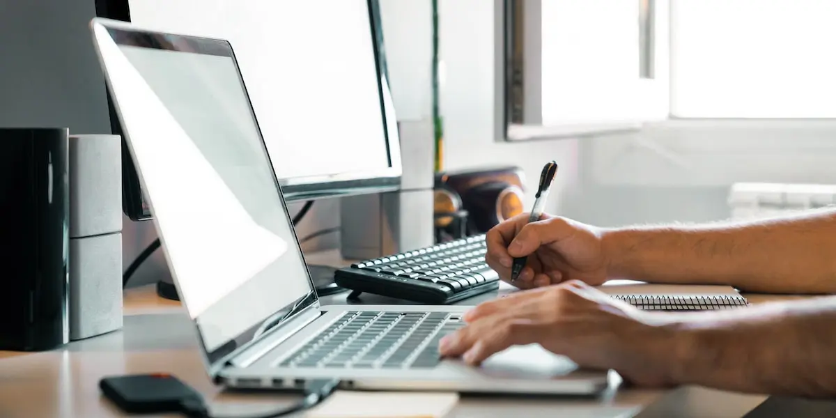 Person learning Python on their computer at home