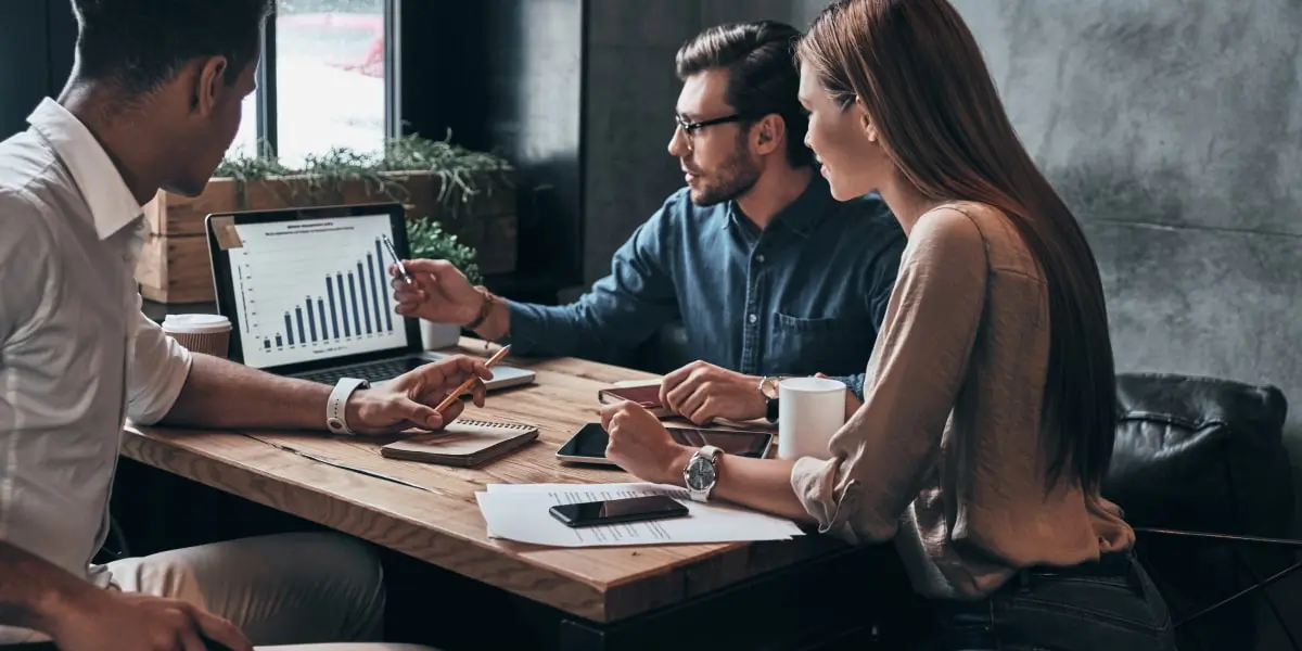 data analysis qualitative quantitative Group of data analysts looking at a data visualization on a computer