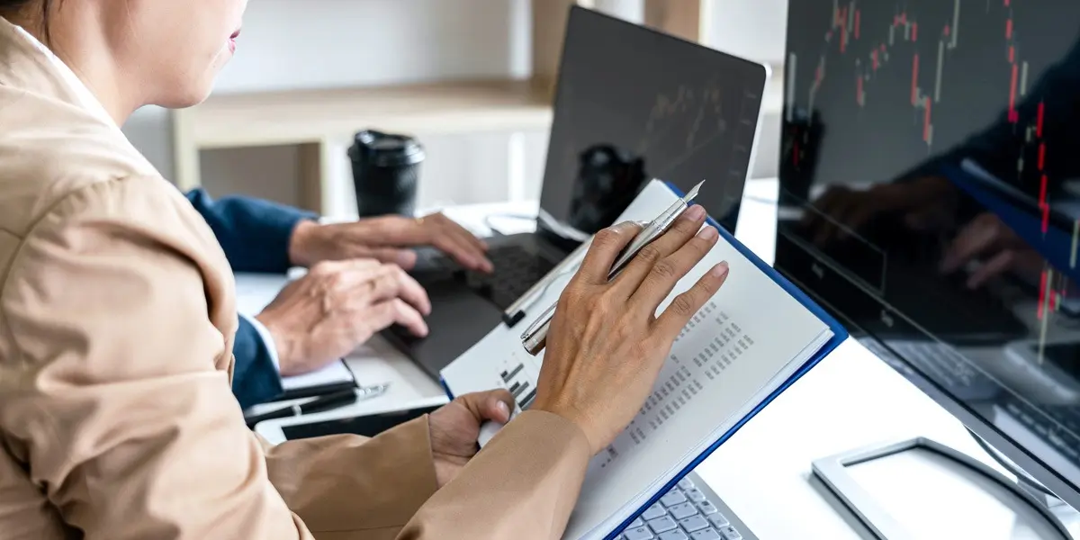 A data analyst looking at a document