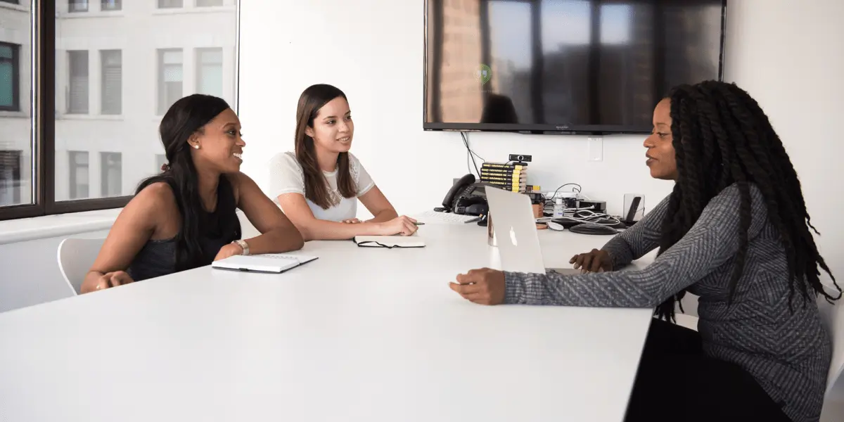 A hiring panel interviewing a UI designer