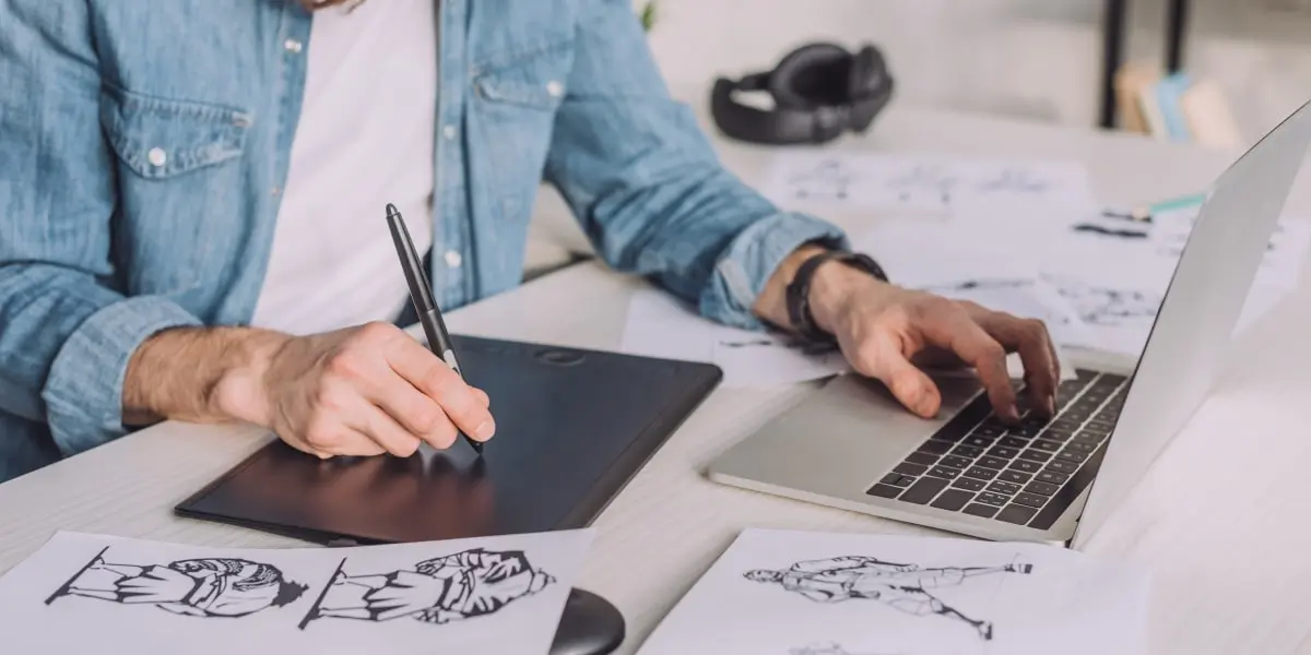 The best free storyboard templates A designer using a storyboard template to create a storyboard with a laptop