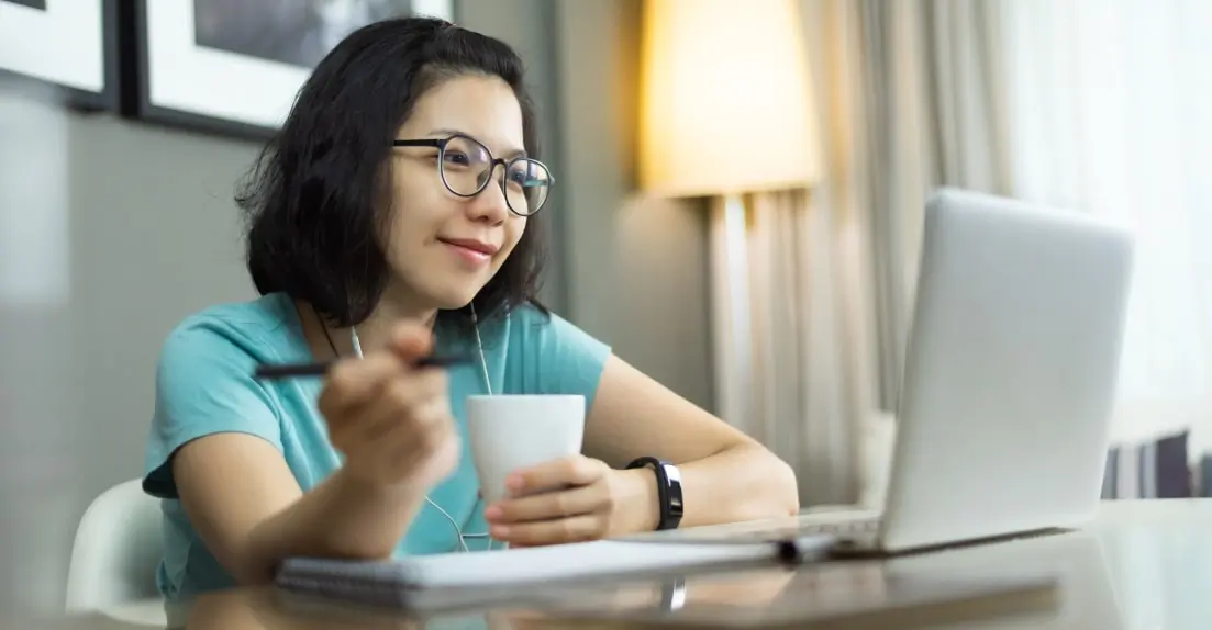 A freelance UX designer working on a laptop