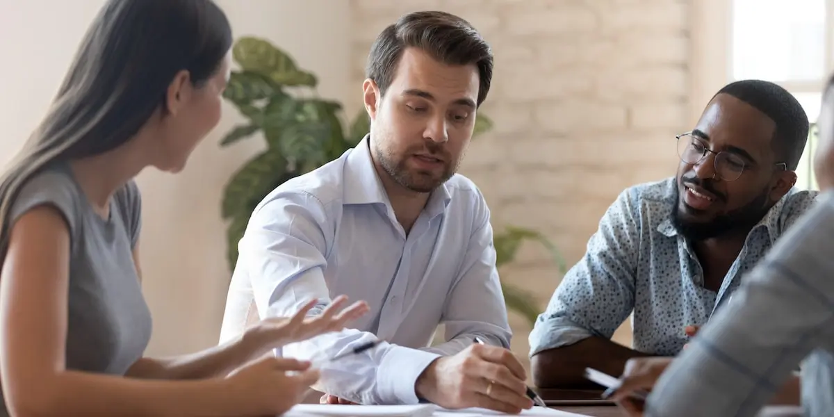 Team looking at digital marketing examples together