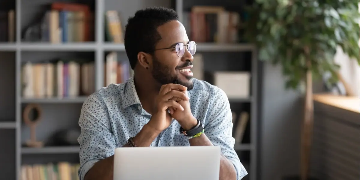 Man taking a break from his laptop where he is learning how to become a frontend developer