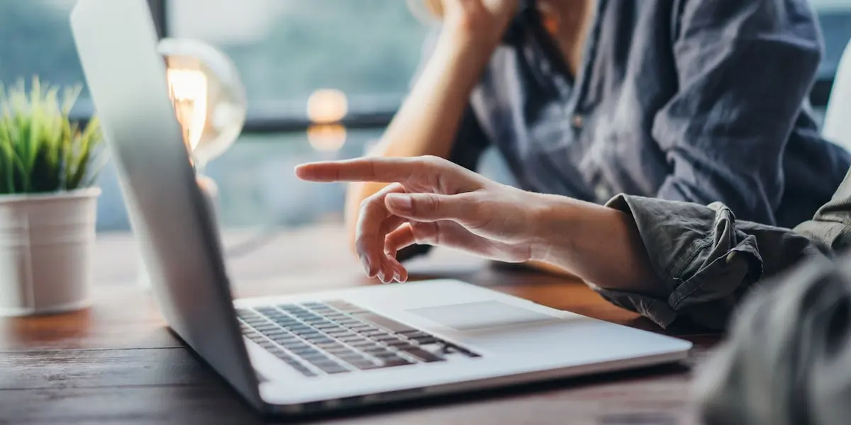 Students working on a laptop towards their SEO certification