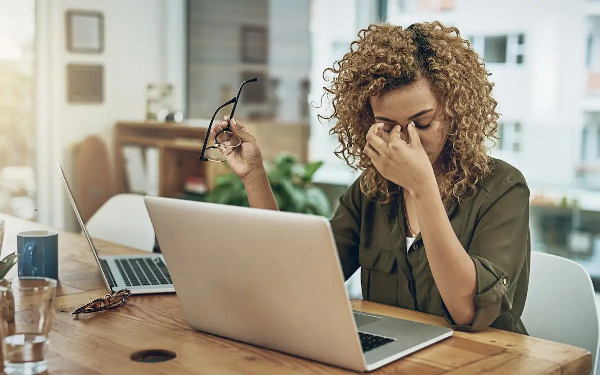 proactive security management can help avoid these moments A frustrated developer pinches her nose after finding an AWS security mistake.