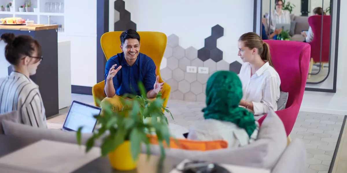 A product manager in a meeting explaining the minimum viable product of the company to colleagues.