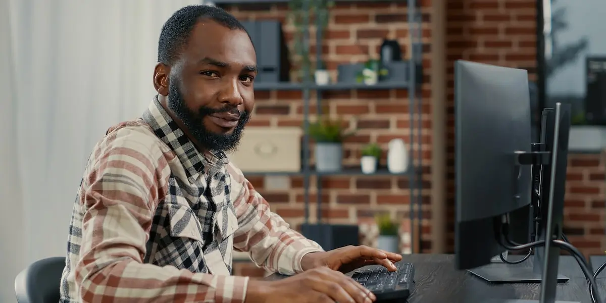 Man deciding between an online marketing degree and an online digital marketing program