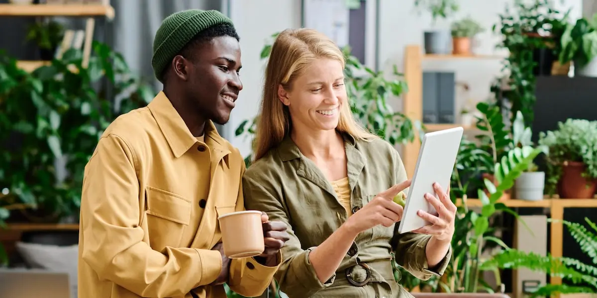 Colleagues working together on their entry level digital marketing jobs