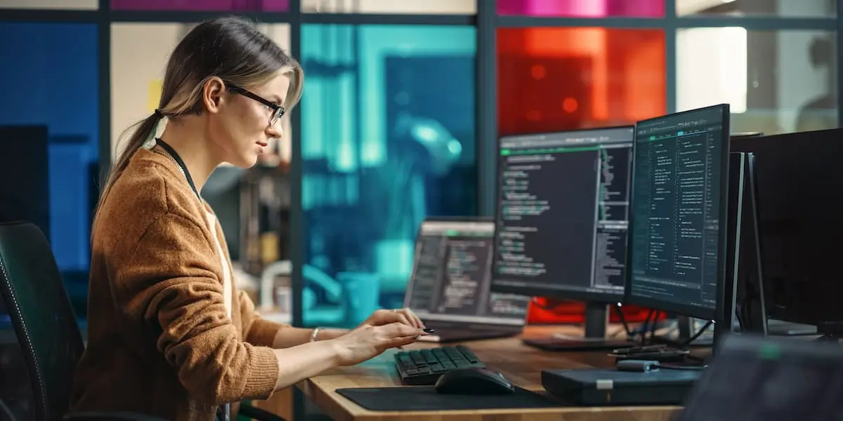 a young software engineer, one of the best paying jobs in technology, works at her desk