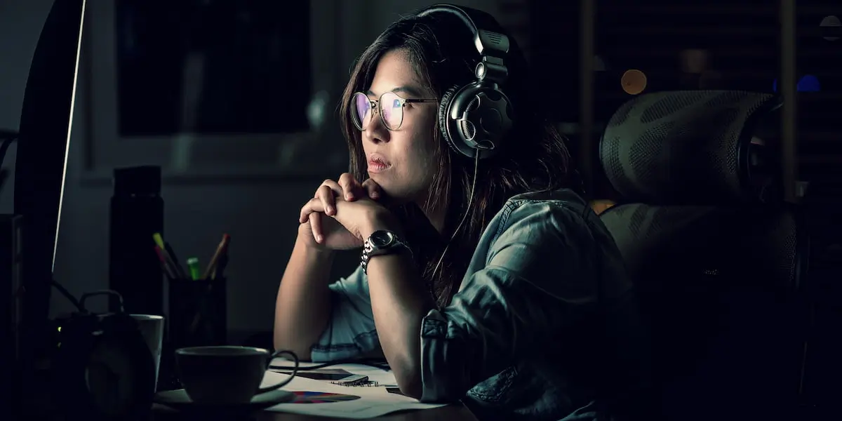 A young employee works at her desk in her role as a data scientist, one of the best entry level IT jobs
