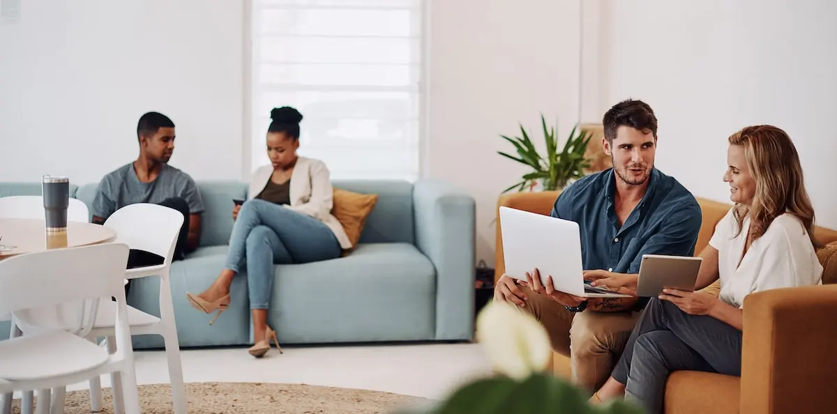 software engineer opportunities in germany vary Man earning a software engineer salary in Germany has an informal meeting on a sofa.