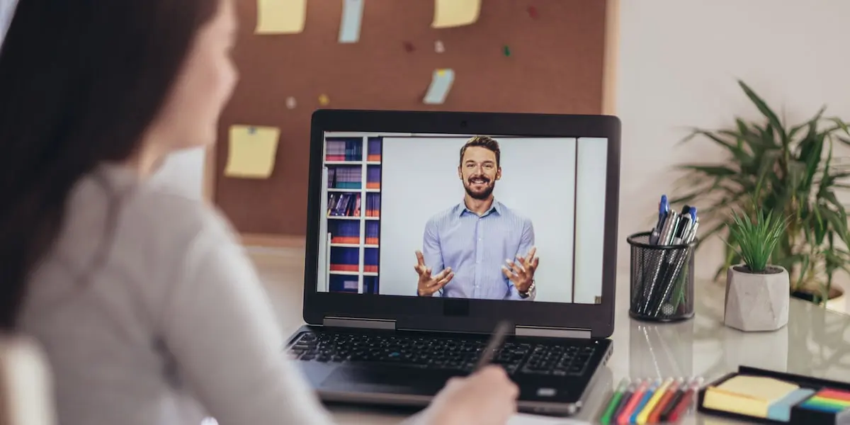 A woman taking a data analytics online course on their laptop.