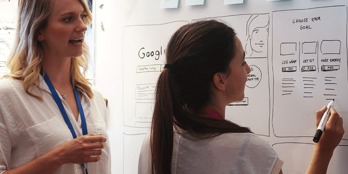 UX designers collaborating on a project UX designers collaborating on a project