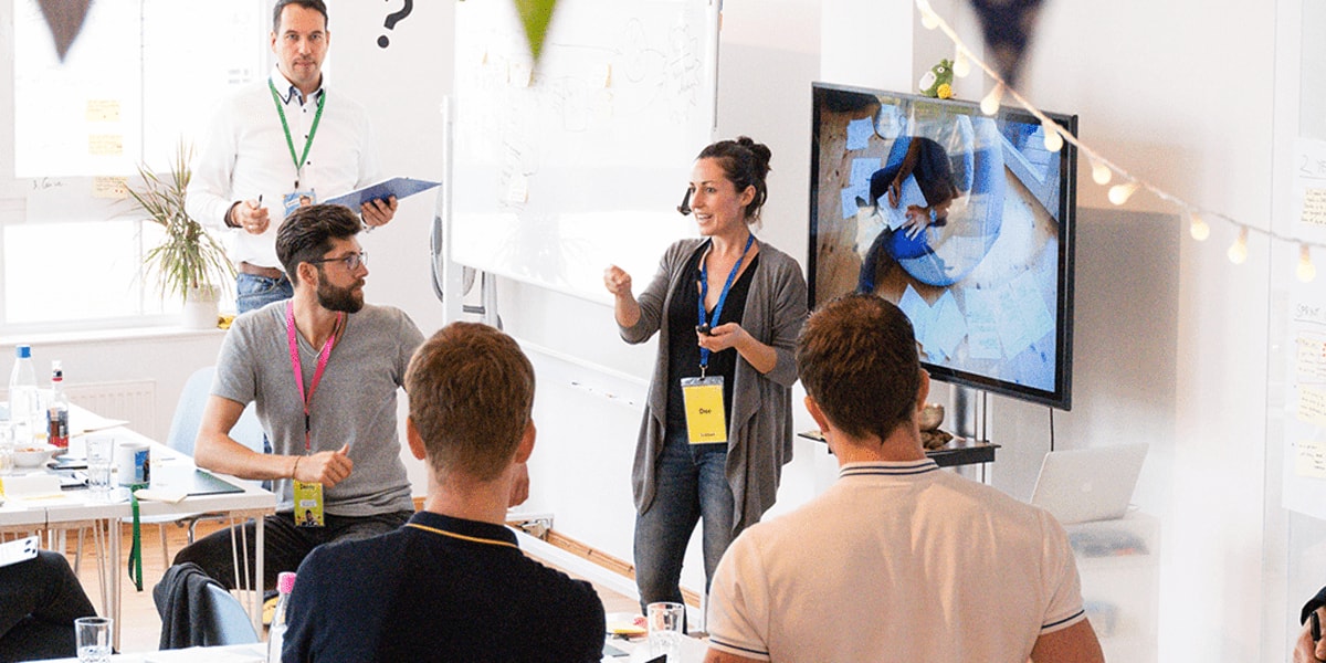 UX designers at a workshop together UX designers at a workshop together