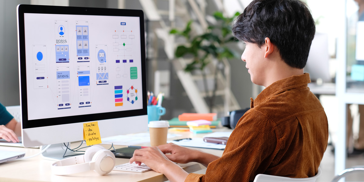 How To Learn UX Design And Become A UX Designer UX designer working on their portfolio.