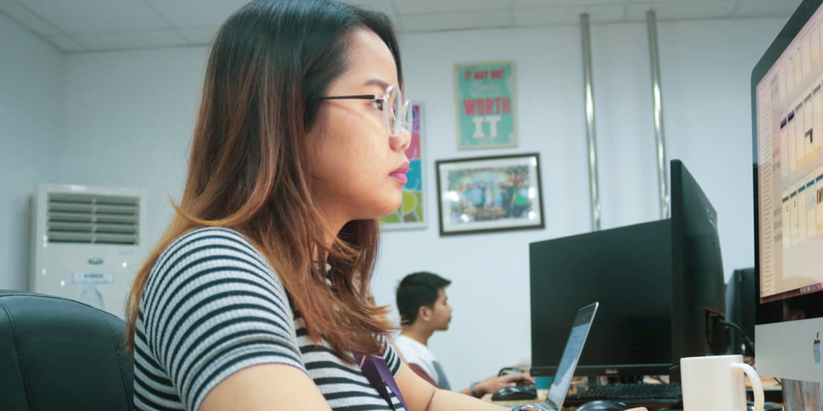 A UI designer sitting in front of laptop
