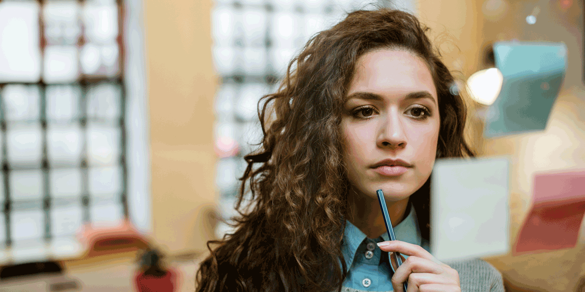 A UX designer thinking about what to include in her resume