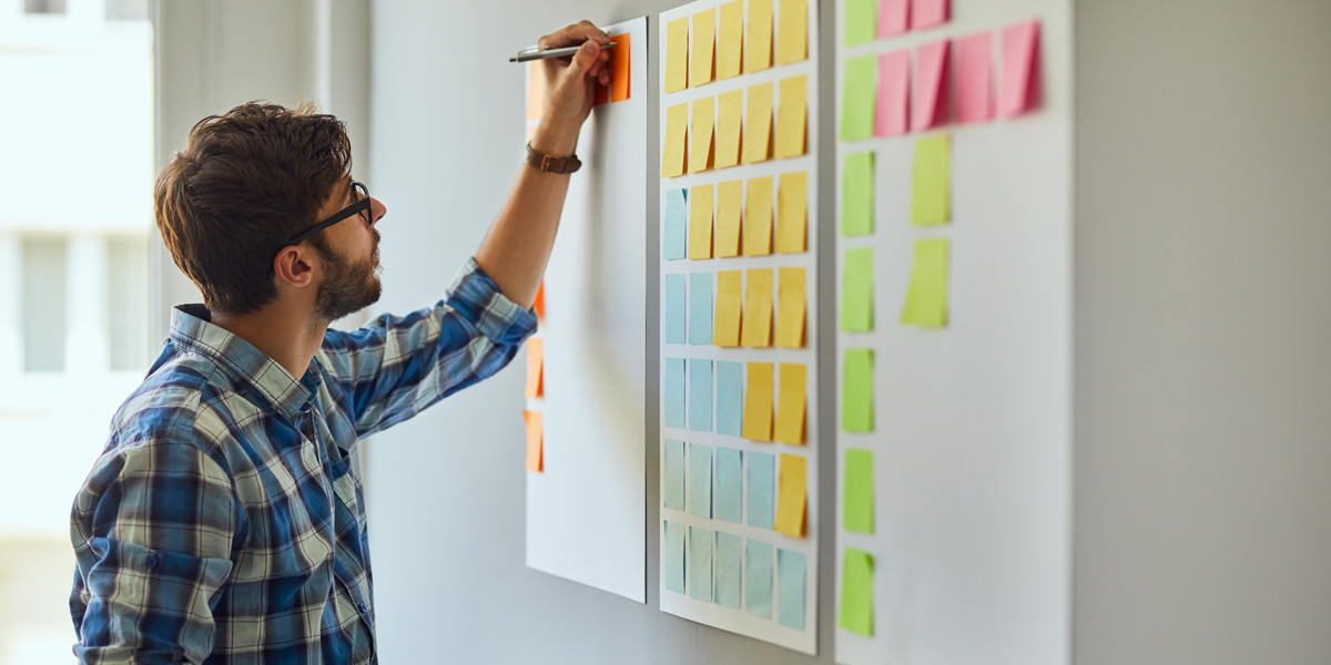 How to Get a Job in UX with No Industry Experience UX design bootcamp student working on an affinity diagram