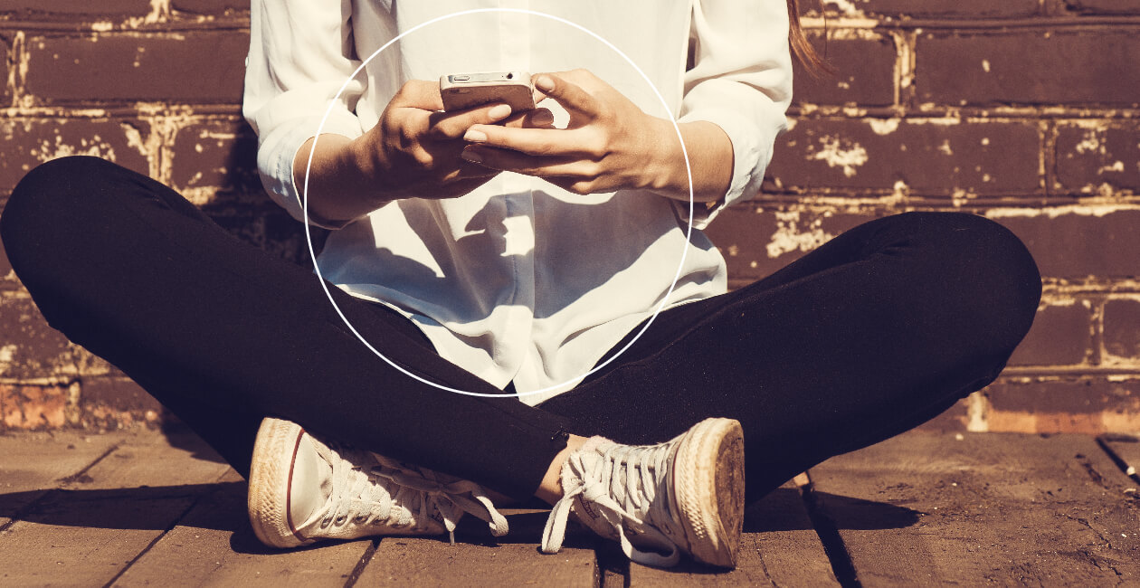 A man using his phone to manage freelance work