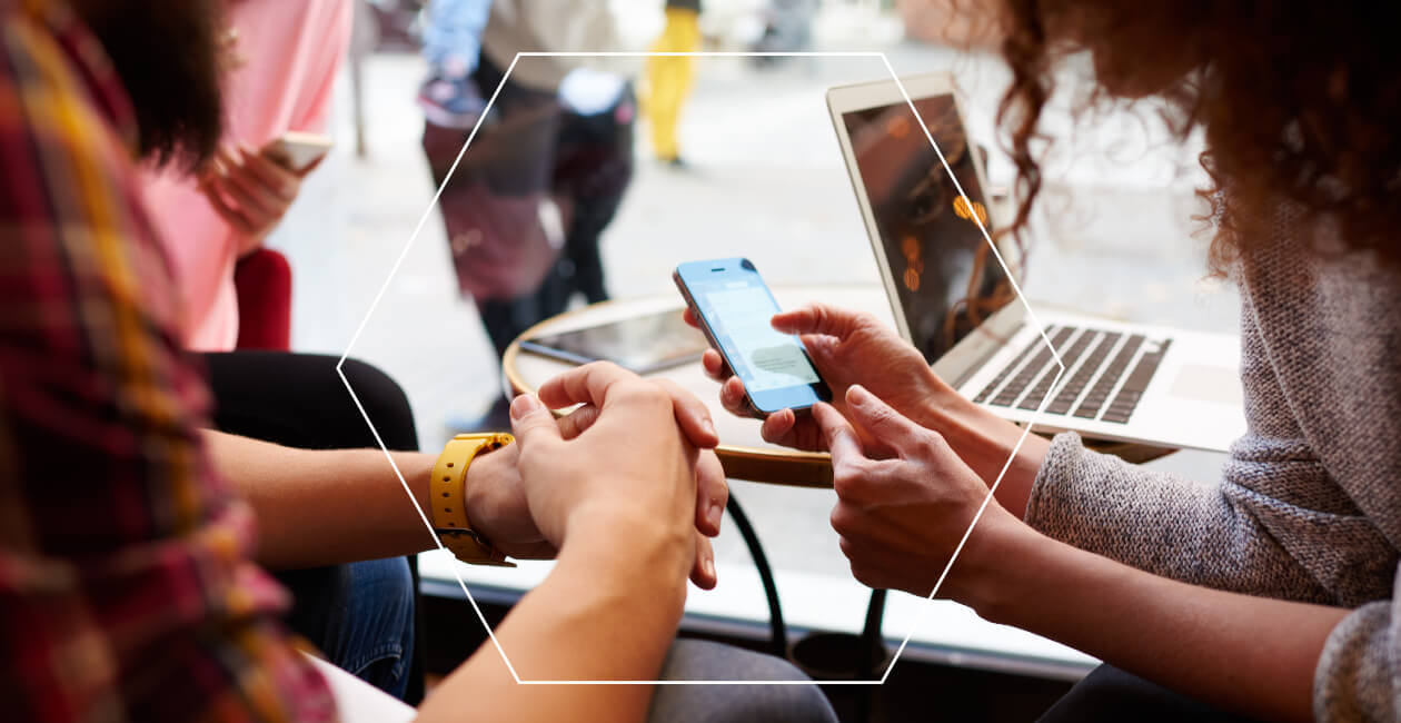 Two freelance designers looking at a phone