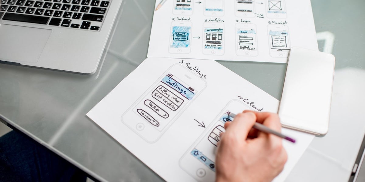 A web developer reviewing designs from the design team