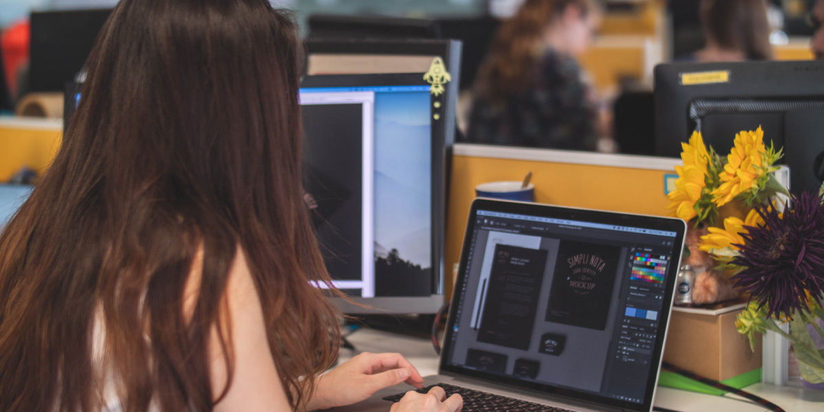 A digital designer working on visual assets