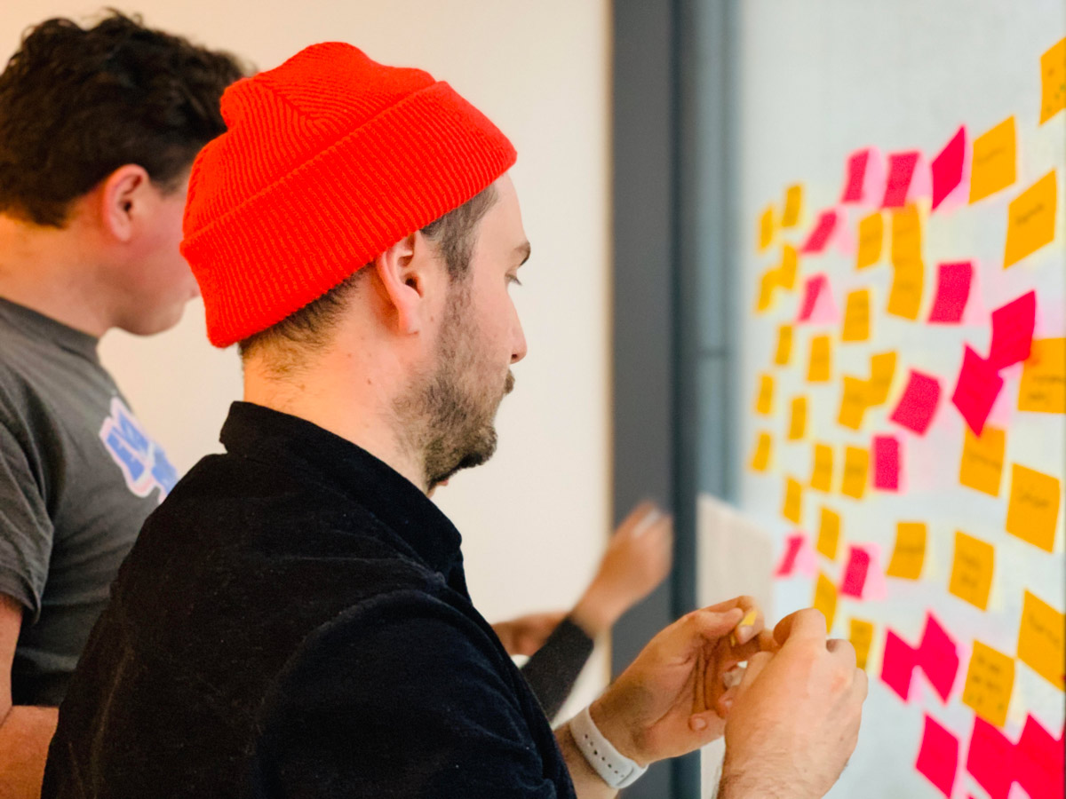  Participants sharing ideas on sticky notes in a design thinking workshop